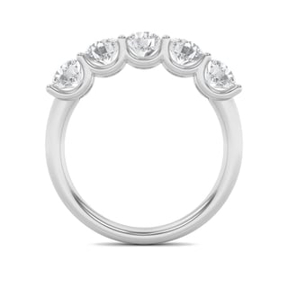 White gold band ring featuring five round diamonds set in bezel settings along the top