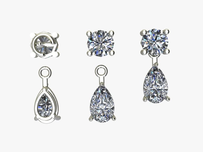 Collection of diamond jewelry pieces including earrings and pendants in white metal settings