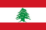 Flag of Lebanon featuring a green cedar tree centered on white stripe between red horizontal stripes