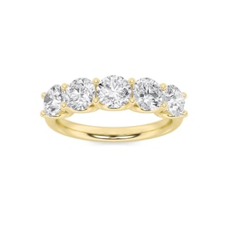Gold wedding band with five round diamonds set in a curved arrangement