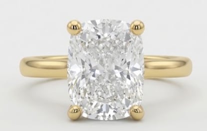 Gold engagement ring with large cushion-cut diamond solitaire stone