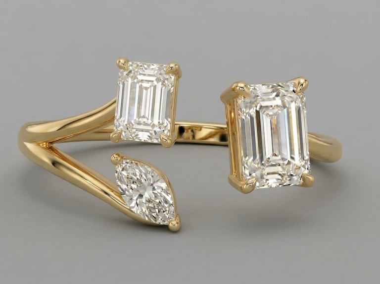 Gold and diamond jewelry collection featuring two emerald-cut diamonds and one marquise-cut diamond set in yellow gold settings