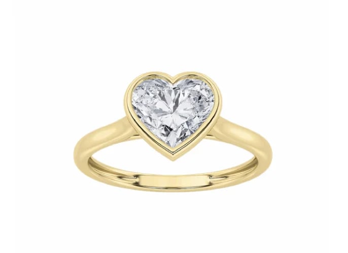 Gold engagement ring with heart-shaped diamond solitaire center stone