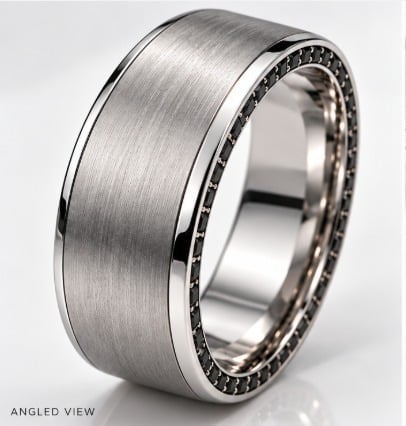 Angled view of a brushed silver wedding band ring with decorative beaded edge detailing
