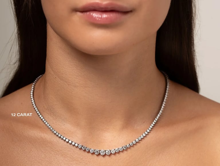 Woman wearing a 12 carat diamond tennis necklace on a neutral background