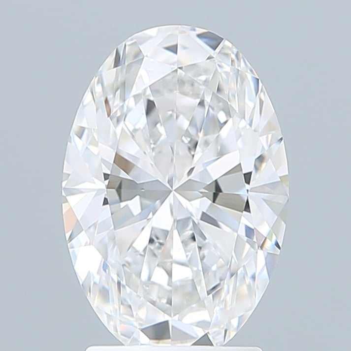 Clear oval-cut diamond with brilliant facets on light gray background