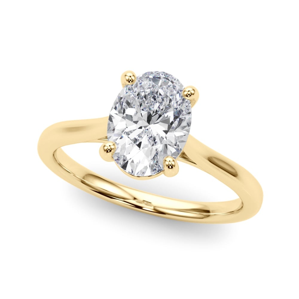 Gold solitaire engagement ring with oval-cut diamond on white background