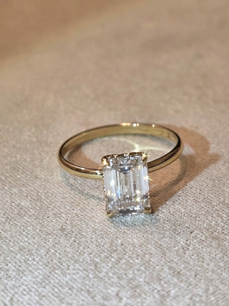 The One Solitaire: 2 carat emerald cut lab grown diamond ring in 14K gold