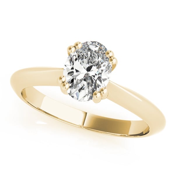 Gold engagement ring with oval-cut diamond solitaire on white background