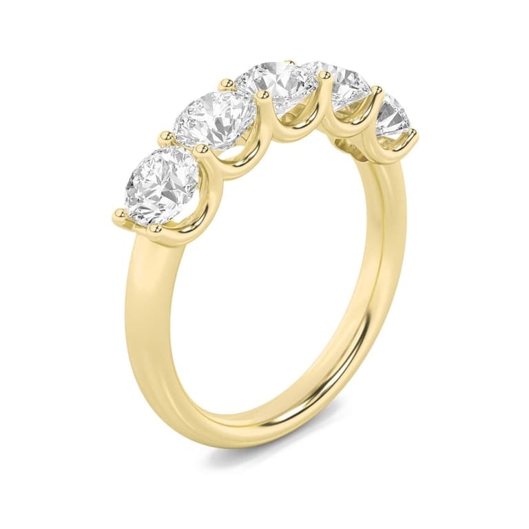 Gold wedding band with five round diamond stones arranged in an arc by Raywan Jewelers