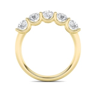 Gold ring with five diamonds set in crescent settings arranged in a curved band pattern