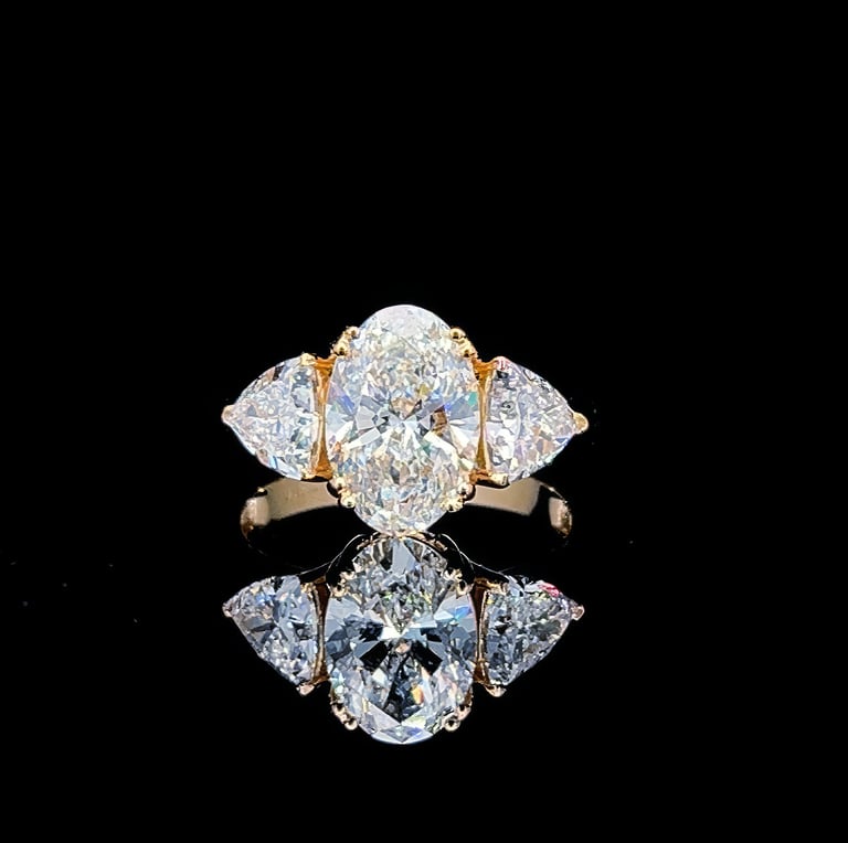 Gold oval diamond engagement ring