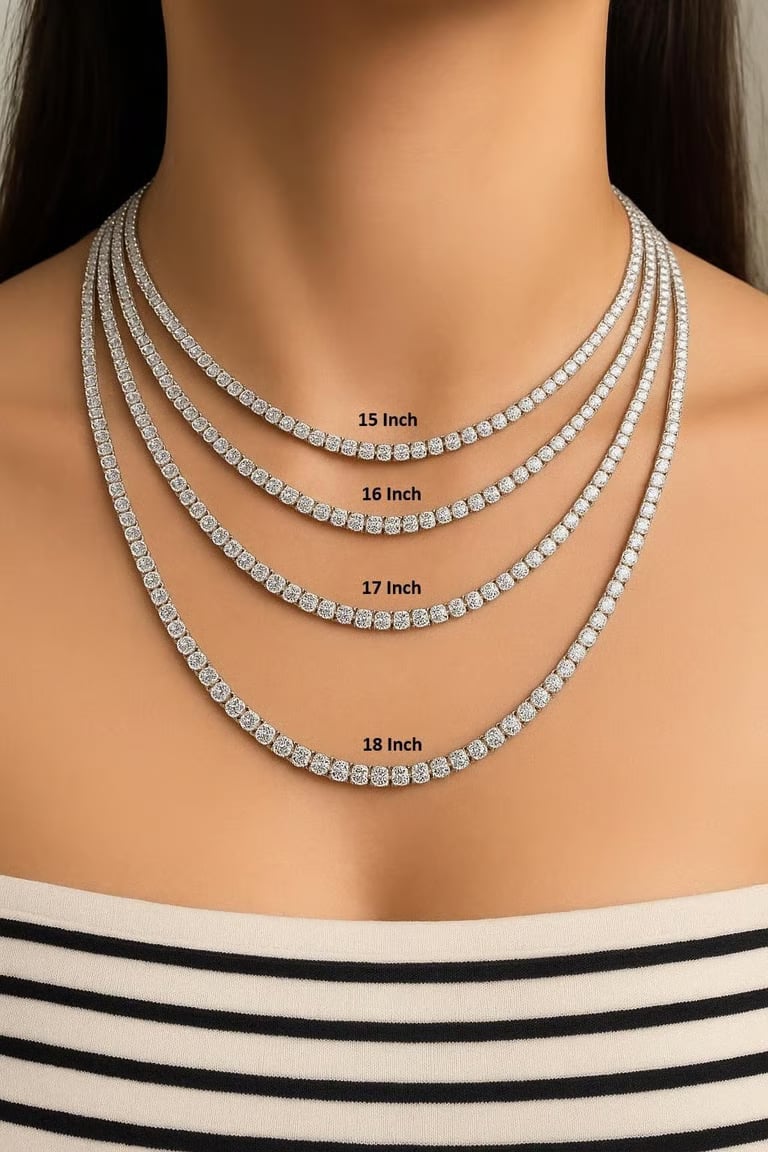 Model wearing layered 14k white gold diamond tennis necklaces in 15, 16, 17, and 18 inch lengths