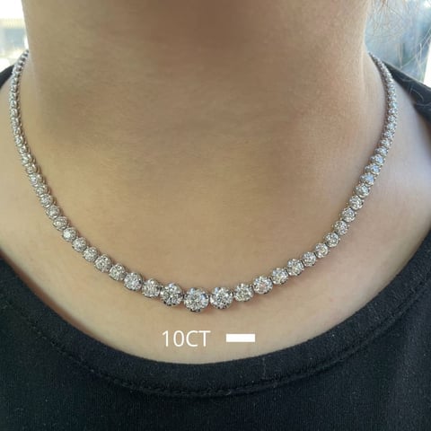 Sparkling diamond tennis necklace with 10 carats worn on a persons neck