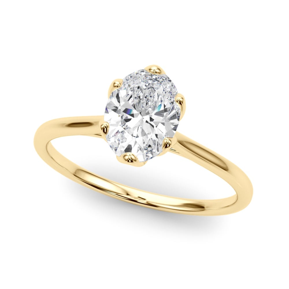 Gold solitaire engagement ring with oval-cut diamond on white background