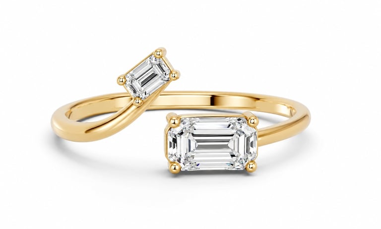 Gold engagement ring with two emerald-cut diamonds set on twisted band