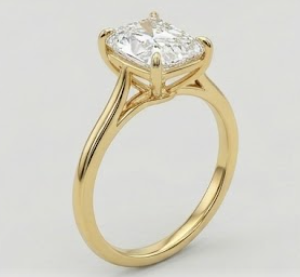 14K yellow gold cathedral solitaire engagement ring with an elongated crushed ice cushion-cut diamond, profile view