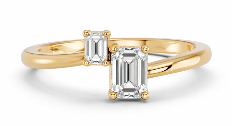 Gold engagement ring with two emerald-cut diamond stones set in a split band design