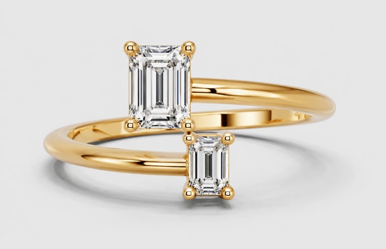 Gold ring with two emerald-cut diamonds set in a crossover design on white background